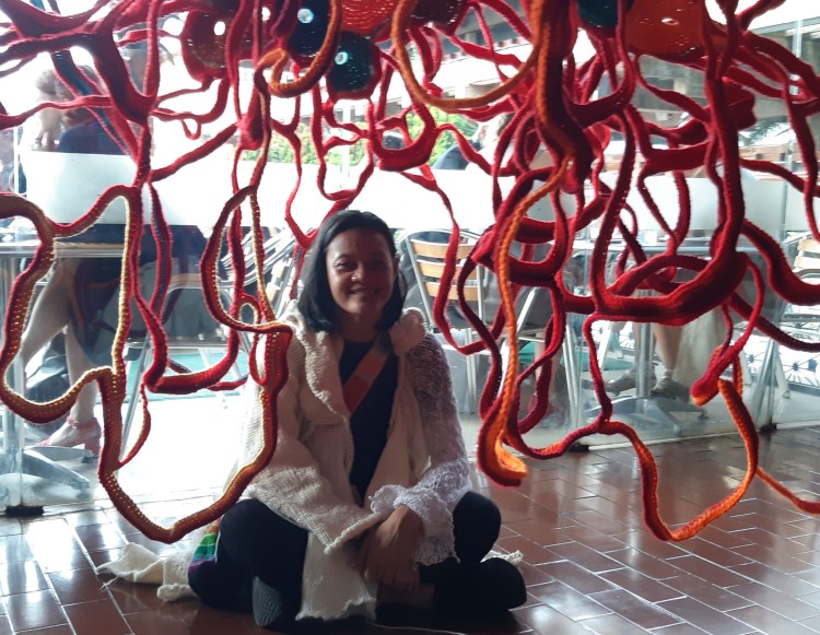 Aze Ong poses beside one of her artworks (2)
