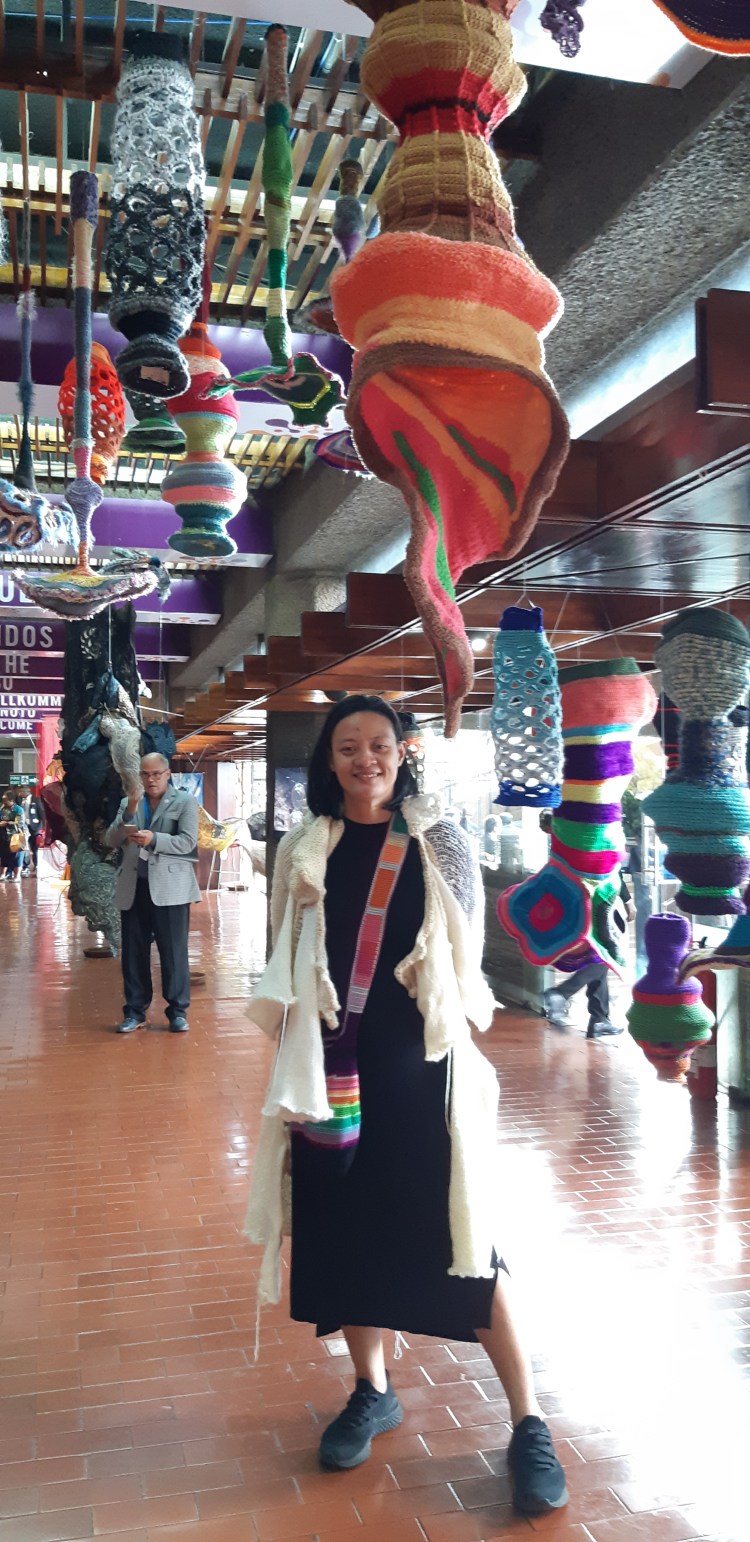 Aze Ong with her artwork